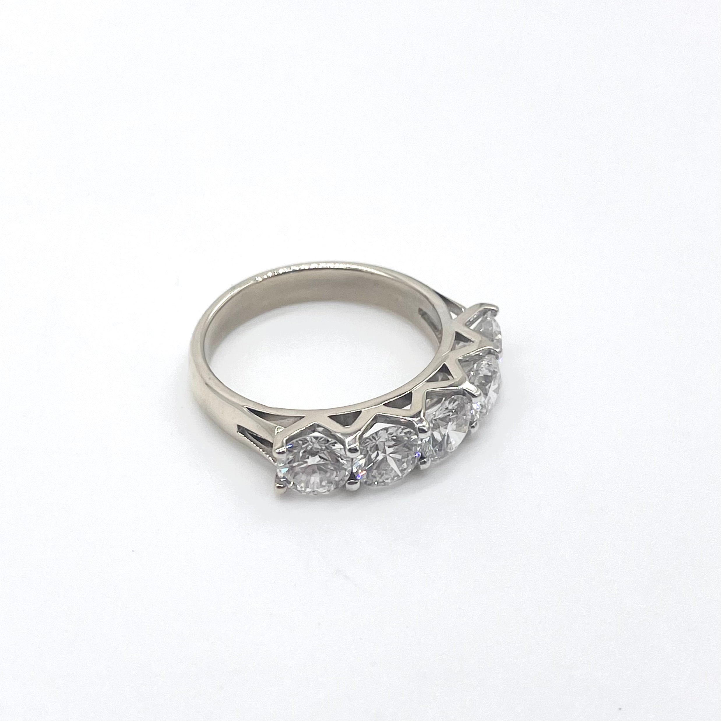 5 Diamonds & 18k White Gold Ring